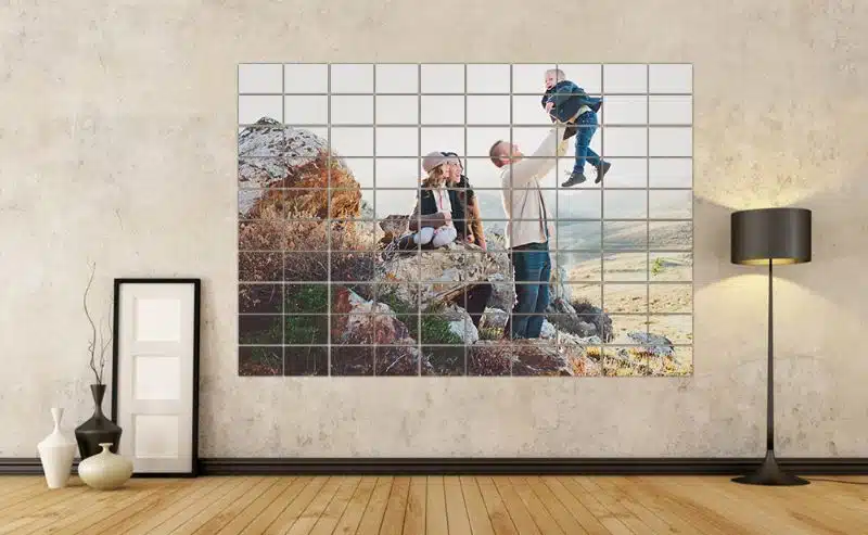 Vibrant family outdoor portrait displayed on a wall art collage with black lamp in modern living room.