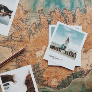 Vast Icelandic landscape map with vintage photos of iconic Icelandic sites and landmarks.