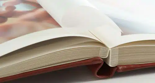 Open hardcover book with blank pages for reading or note-taking.