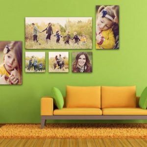 Vibrant family photo collage in living room with green wall and yellow sofa, colourful wall art, modern decor, and warm atmosphere.