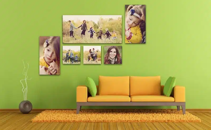 Vibrant family photo collage in living room with green wall and yellow sofa, colourful wall art, modern decor, and warm atmosphere.