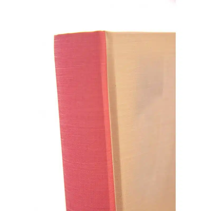 Red hardcover book with beige spine, ideal for bookmarks, reading, and study, perfect for book lovers.