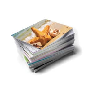 Starfish on a sandy beach, printed on photo paper, ideal for beach-themed wall decor and summer souvenirs.