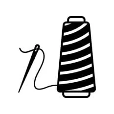 Black spool of thread with needle for sewing or embroidery projects.