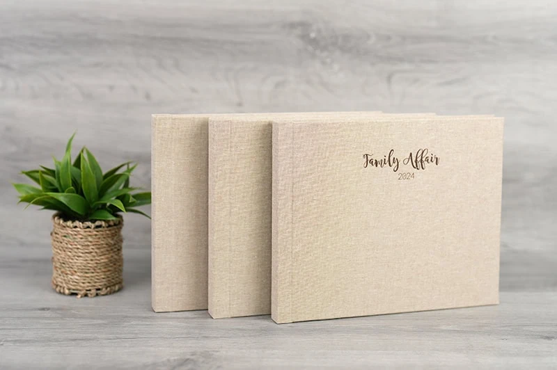 Elegant family photo album with linen cover and "Family Affair" inscription in soft neutral colours.