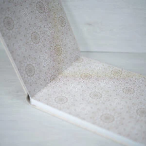 Intricate geometric patterned wallpaper with neutral tones for modern interior decor.